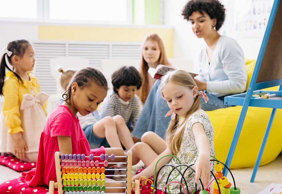 Children learning to count with an abacus